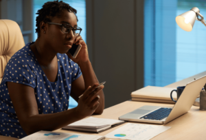 Woman on the phone outsourcing procurement as a service